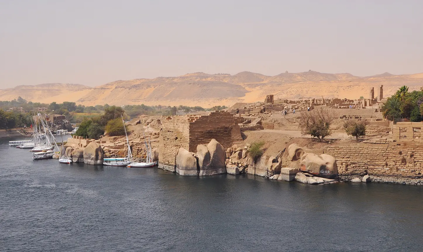 A picturesque view of Elephantine Island on the Nile, featuring ancient ruins, traditional Nubian villages, and lush greenery.