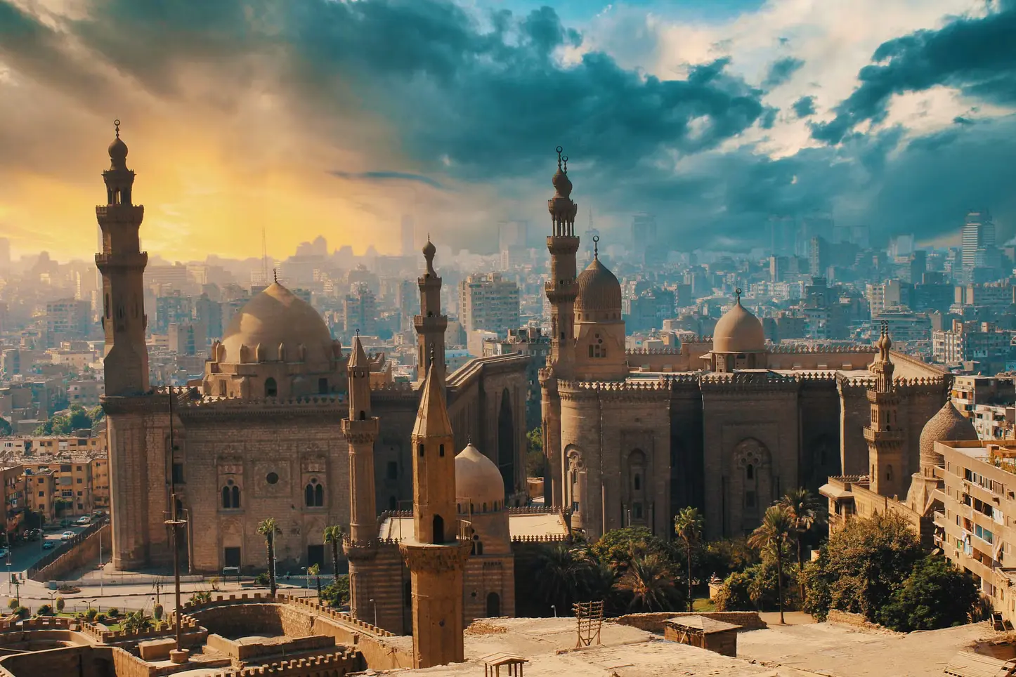 Historic Islamic architecture featuring domes and minarets, paired with a serene Coptic church courtyard in Cairo, Egypt.